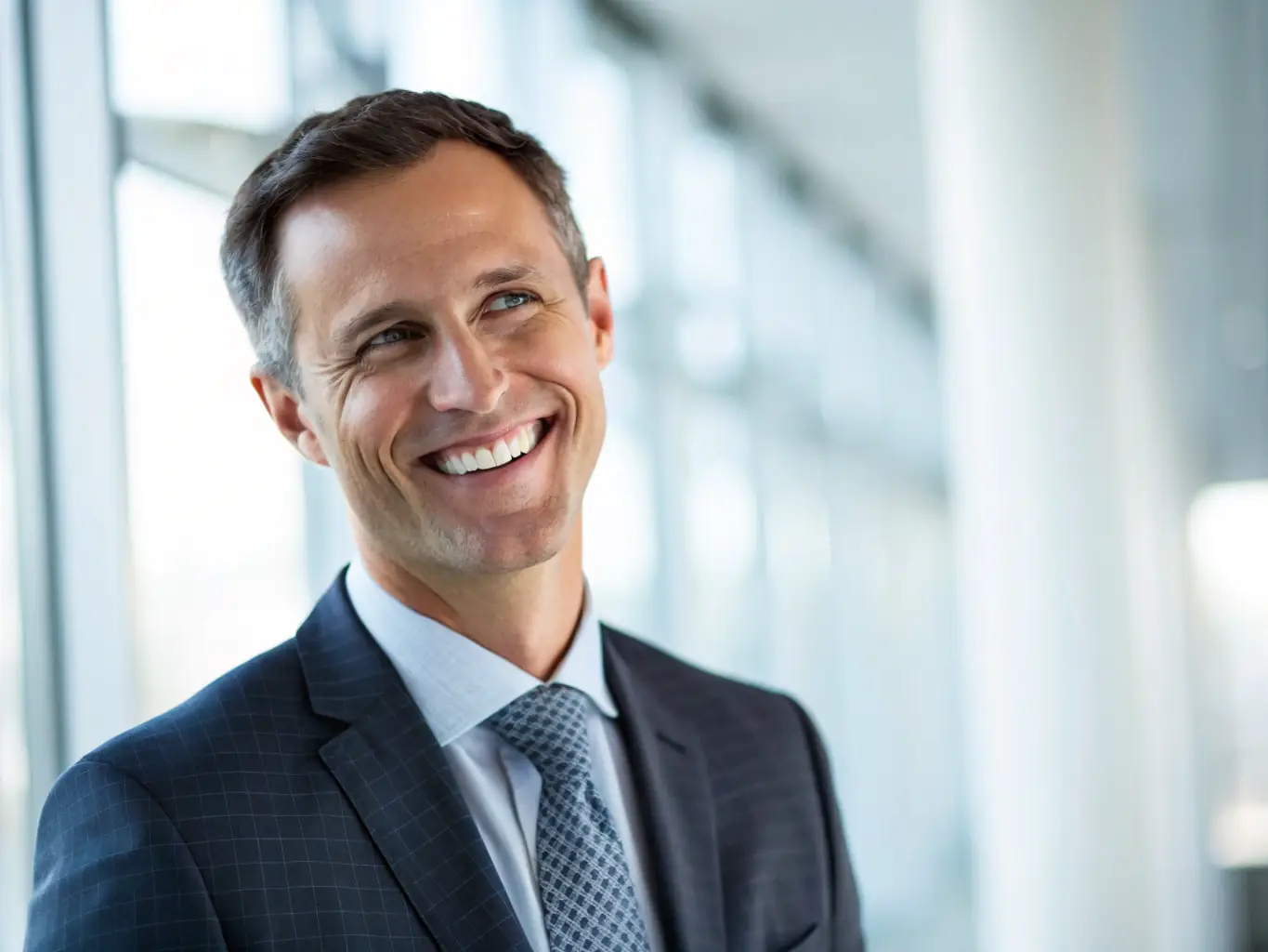 A professional headshot of a Google certified digital marketing expert, smiling confidently in a modern office setting, symbolizing expertise and trust.